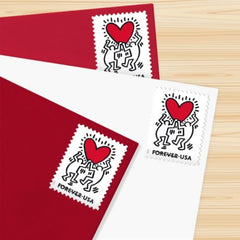 USPS Love 2025 stamp sheet shows two figures reaching toward the heart for expressive mail.