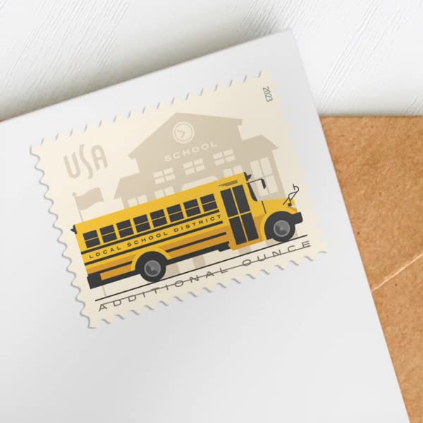 USPS Silhouetted schoolhouse with bus motif on stamps, ideal for school-related mail