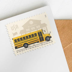 USPS Silhouetted schoolhouse with bus motif on stamps, ideal for school-related mail