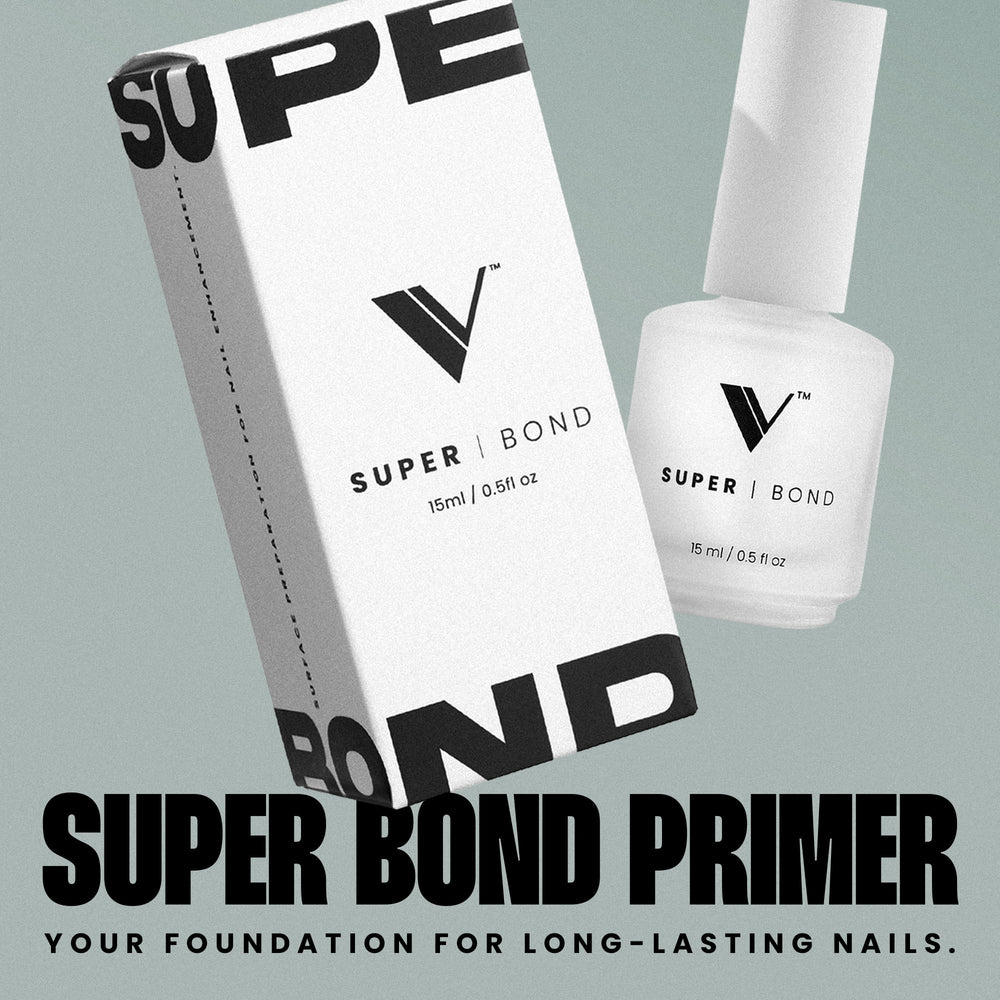 Close-up of V Beauty Pure Super Bond Primer on the nail plate improving adhesion.