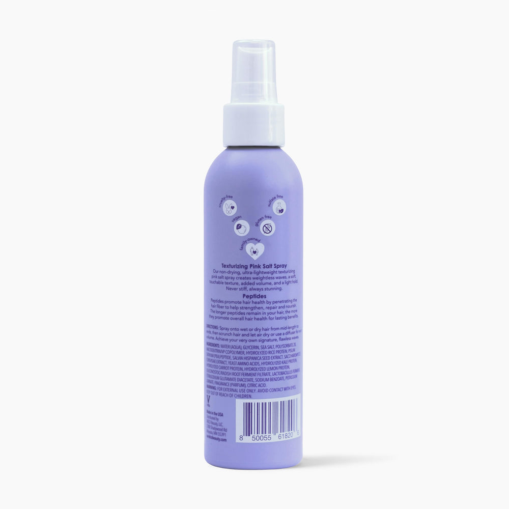 Color-safe Wave Babe spray protects vibrant hair during styling.