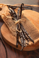 Hand holding pliable vanilla pods from Vanilla Bean Kings.