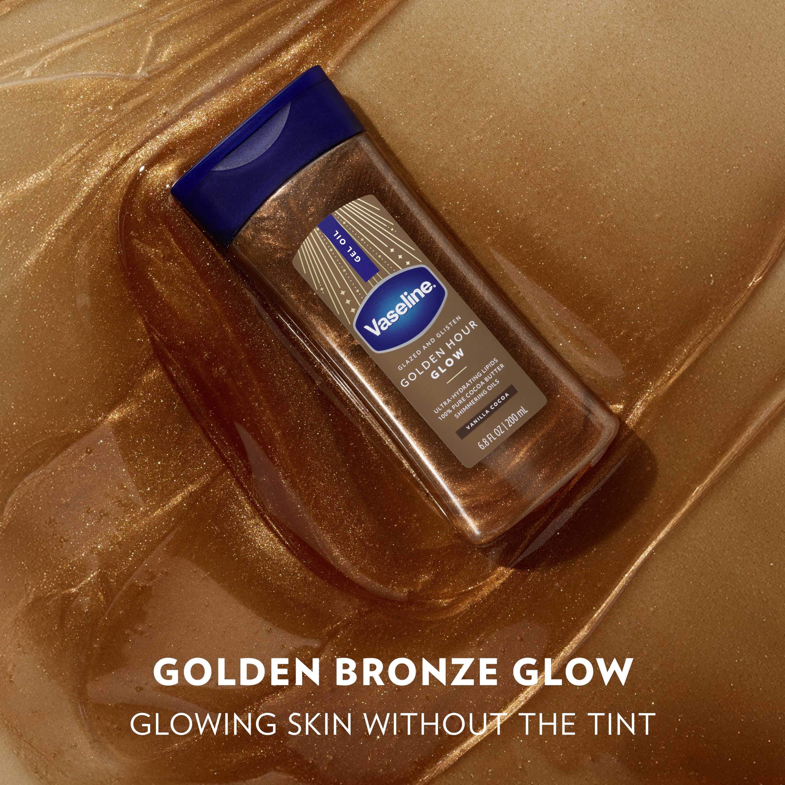 Shoulder and collarbone glow with Vaseline Golden Hour shimmer for a dewy finish.