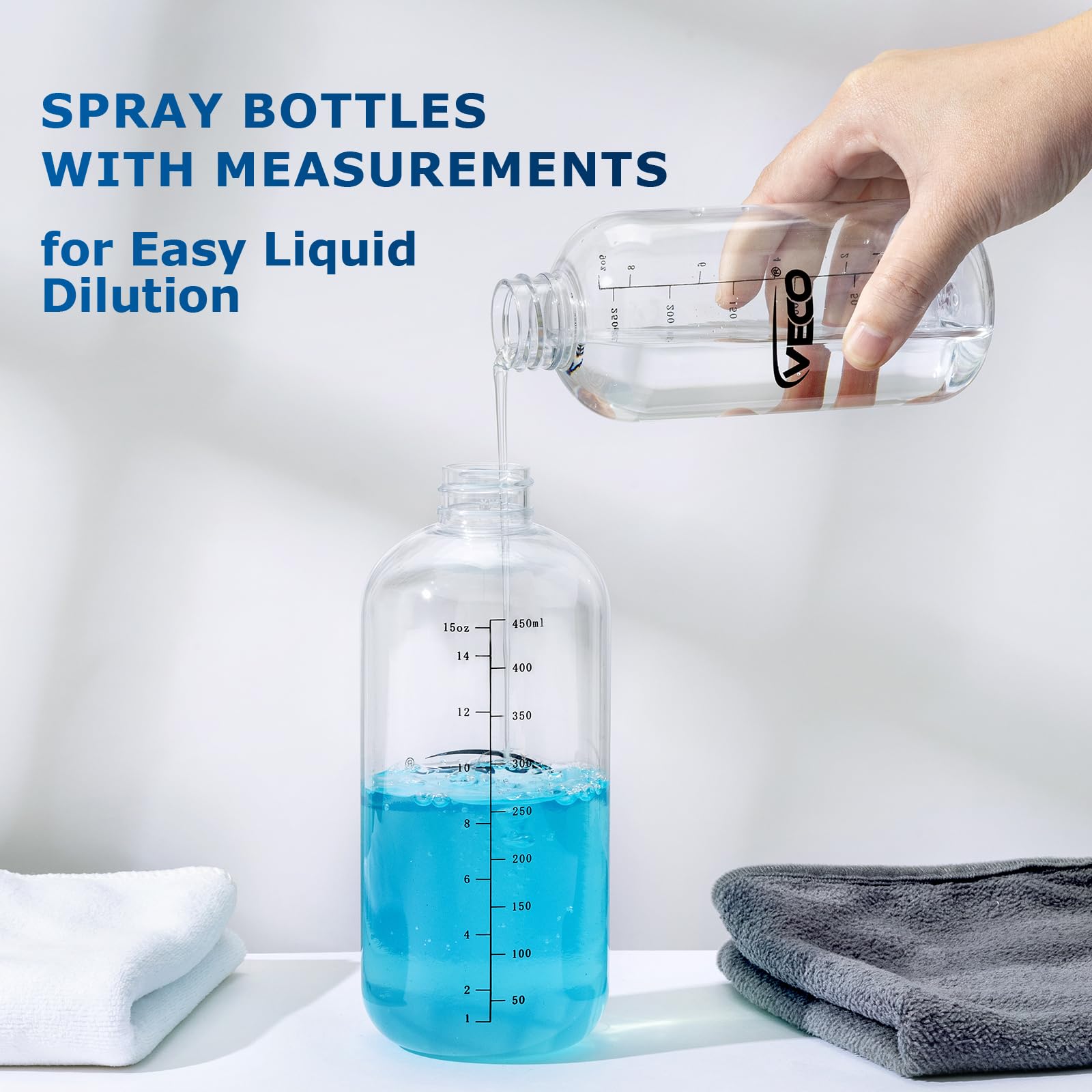 Veco four-pack spray bottles with measurement markings for precise dilution.