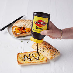 Vegemite Squeezy bottle with crackers for a satisfying snack.