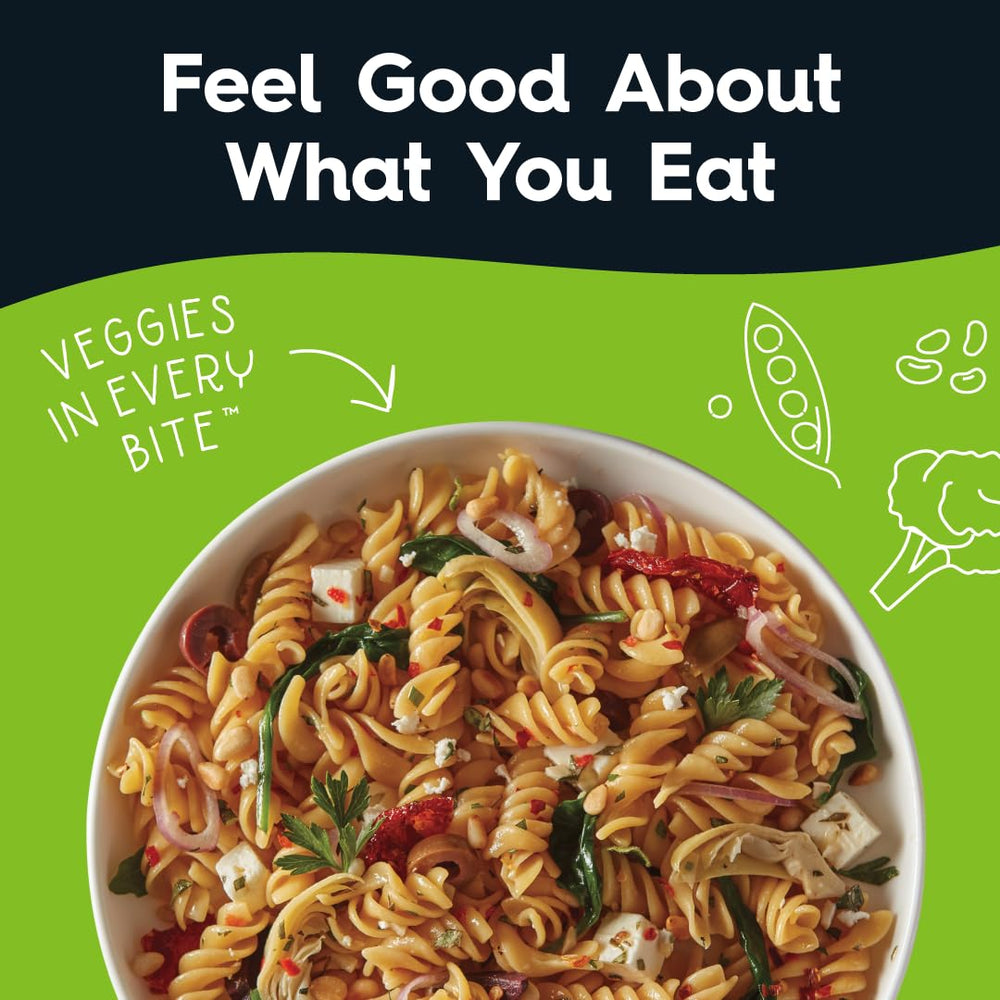 Veggiecraft Farms Rotini pasta cooking in pot for quick, protein-rich dinner prep.