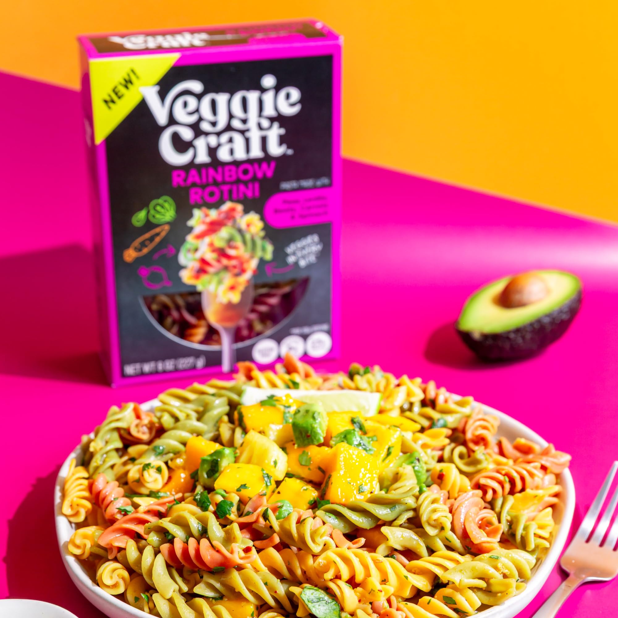 Veggiecraft Farms serving-ready rainbow rotini plated with sauce.