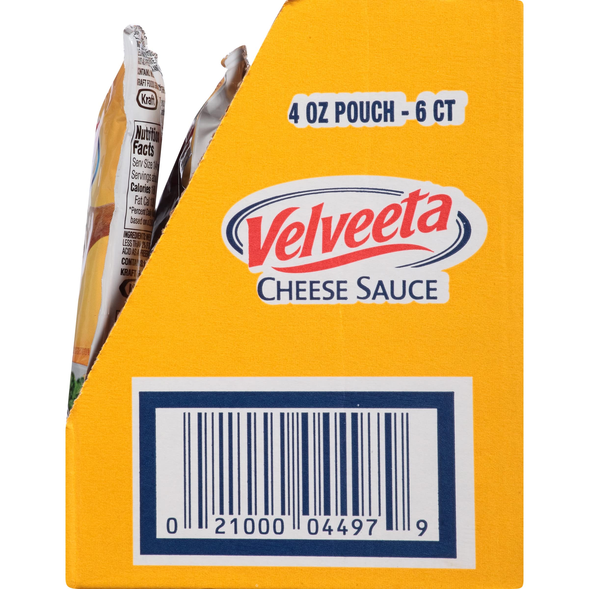 Baked potato topped with Velveeta cheese sauce drizzle.