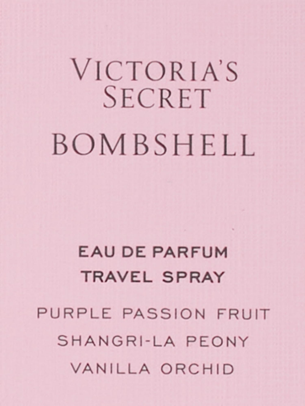 Victoria's Secret Bombshell travel spray in hand for quick refresh.