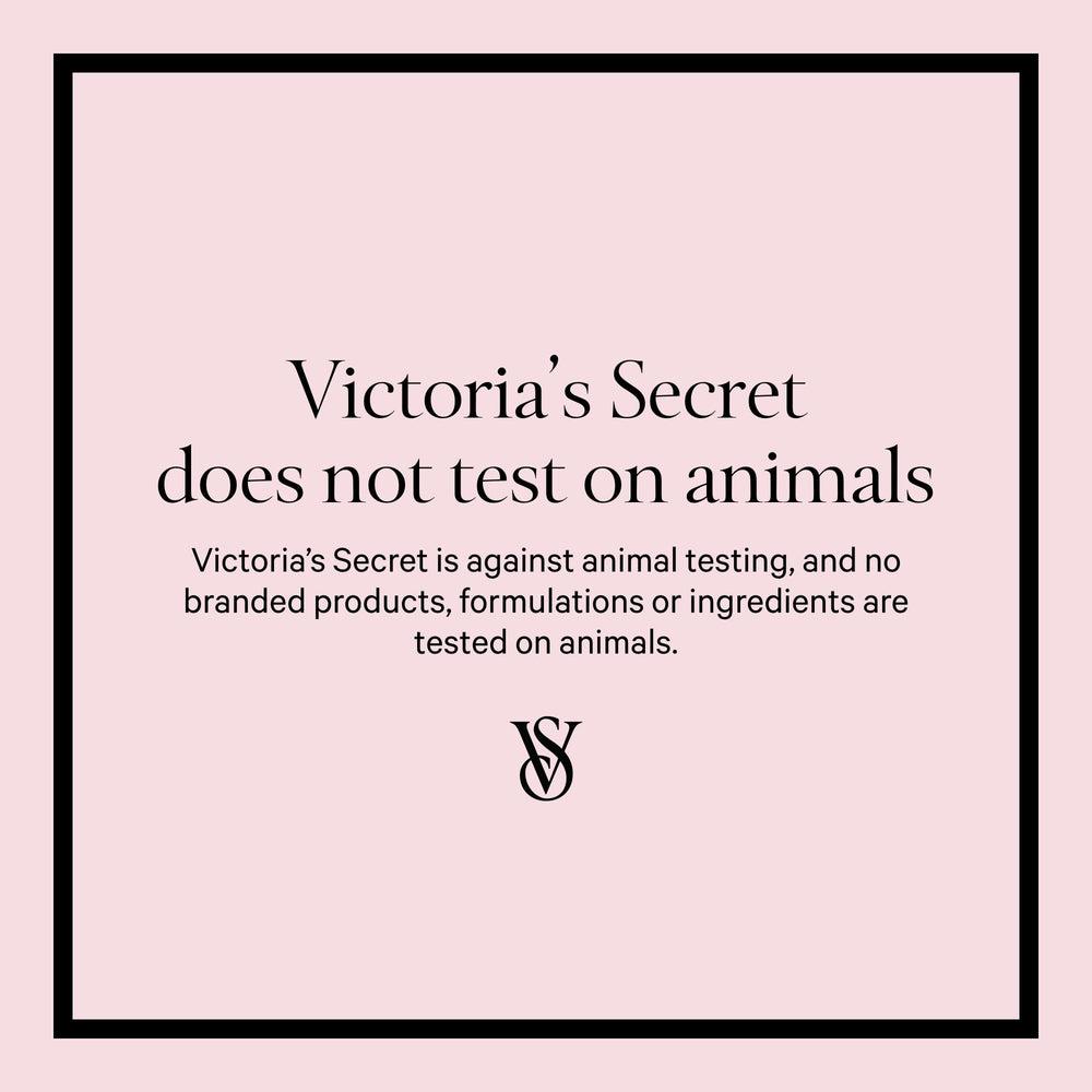 Applying Victoria's Secret fragrance mist on skin for lasting aroma.