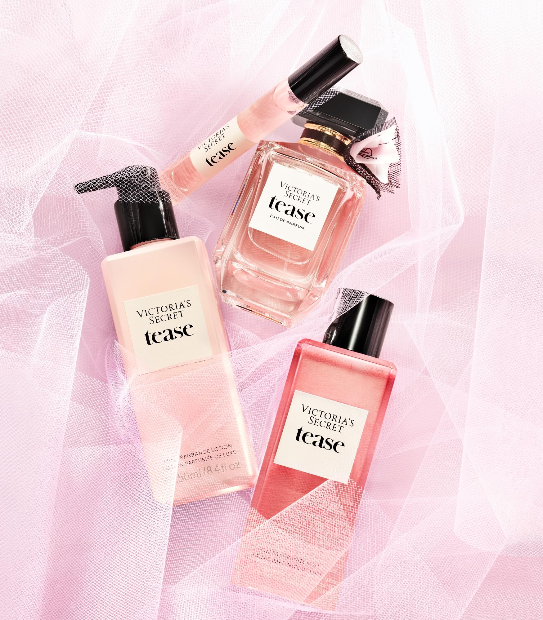 Victoria's Secret Tease bottle in hand, showing portable perfume size.