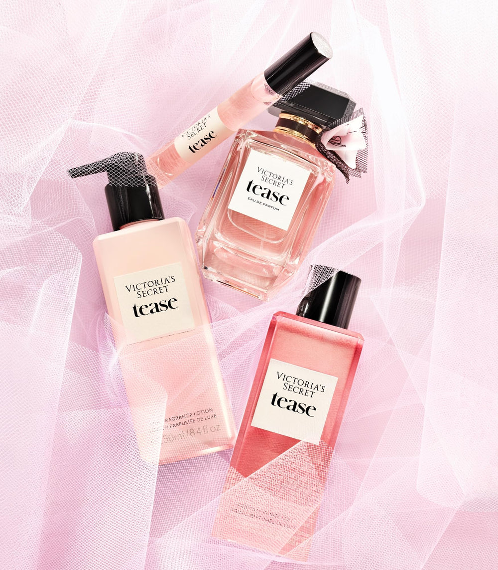 Victoria's Secret Tease bottle in hand, showing portable perfume size.