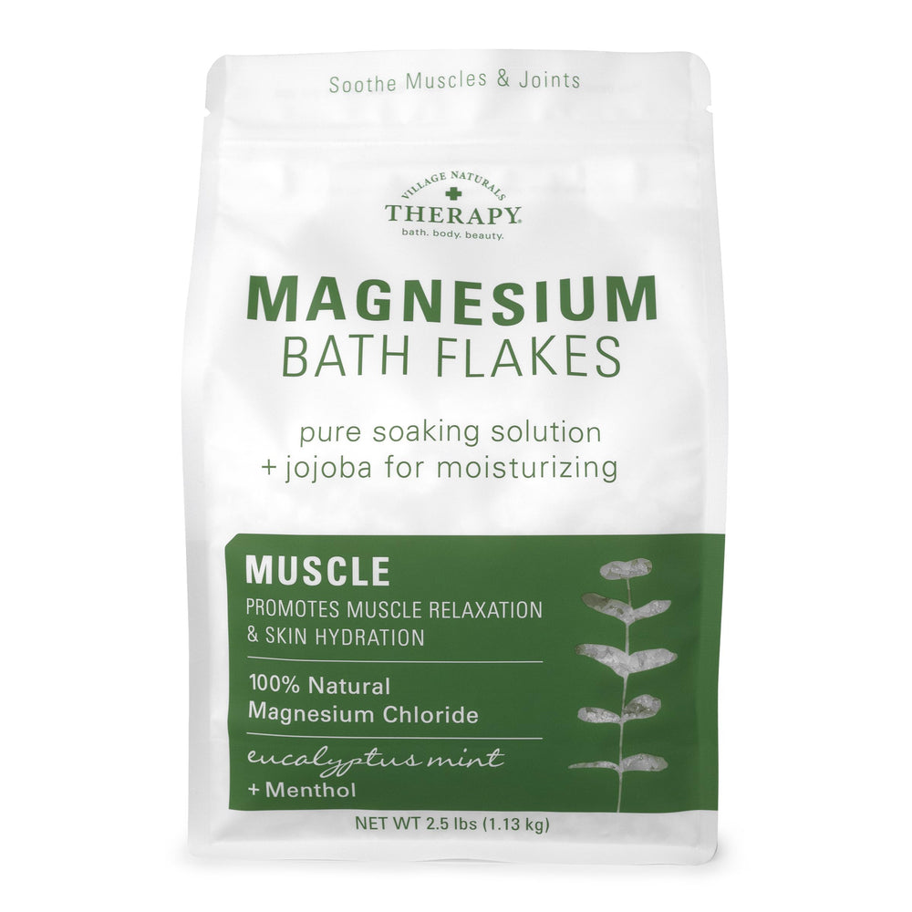 Village Naturals Therapy Muscle Magnesium Bath Flakes with eucalyptus bottle for a calming muscle soak.