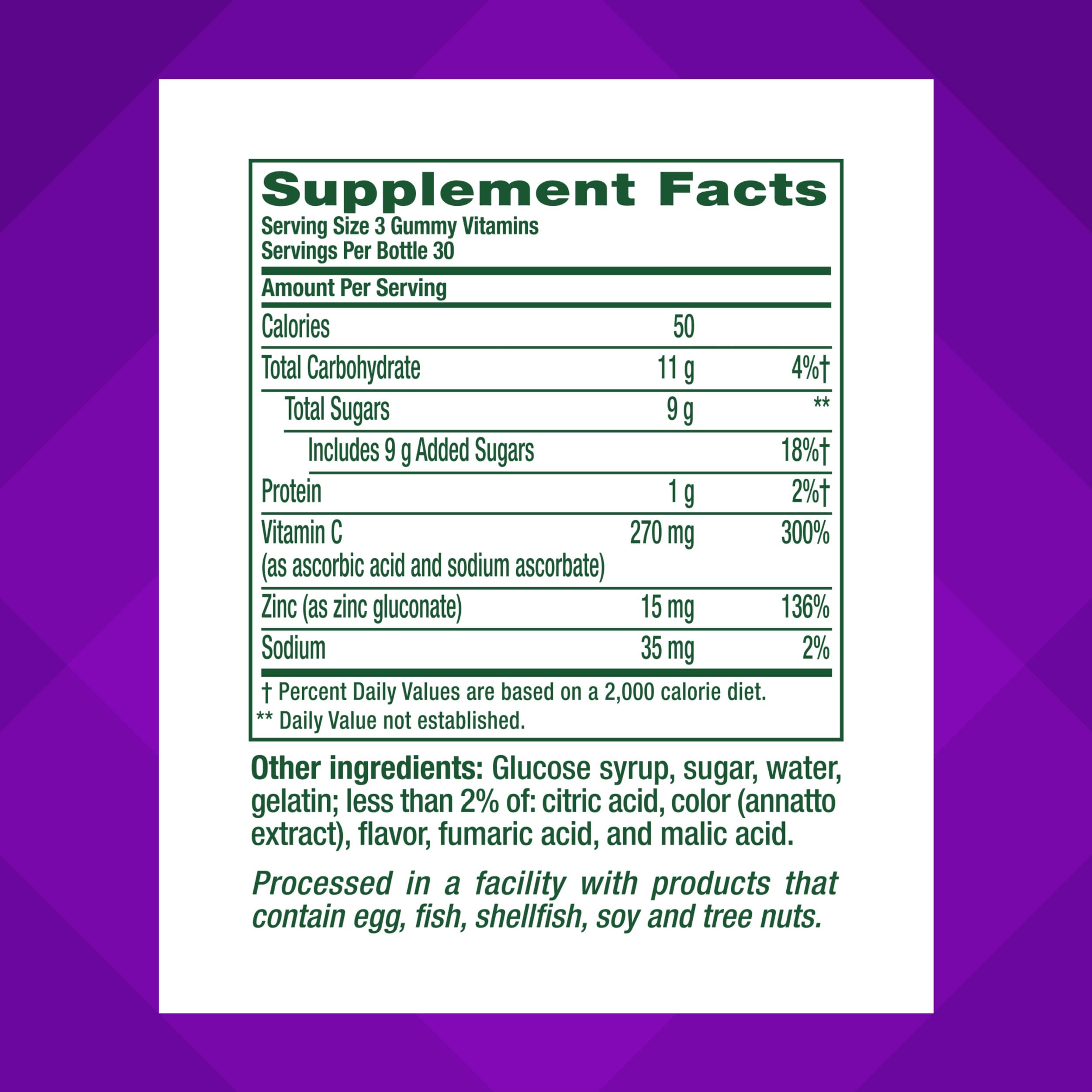 Vitafusion Power Zinc gummies closeup with strawberry-tangerine flavor.