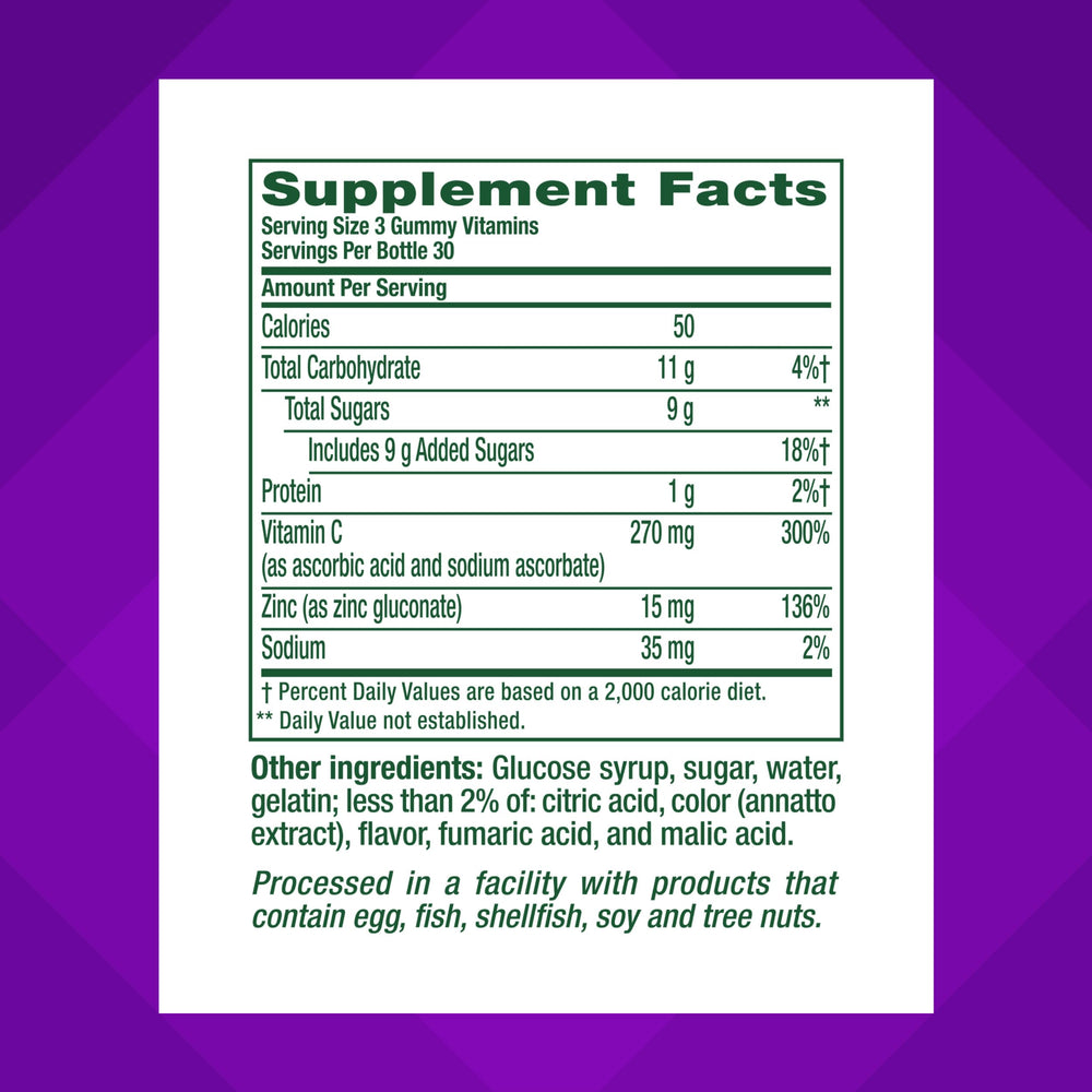 Vitafusion Power Zinc gummies closeup with strawberry-tangerine flavor.