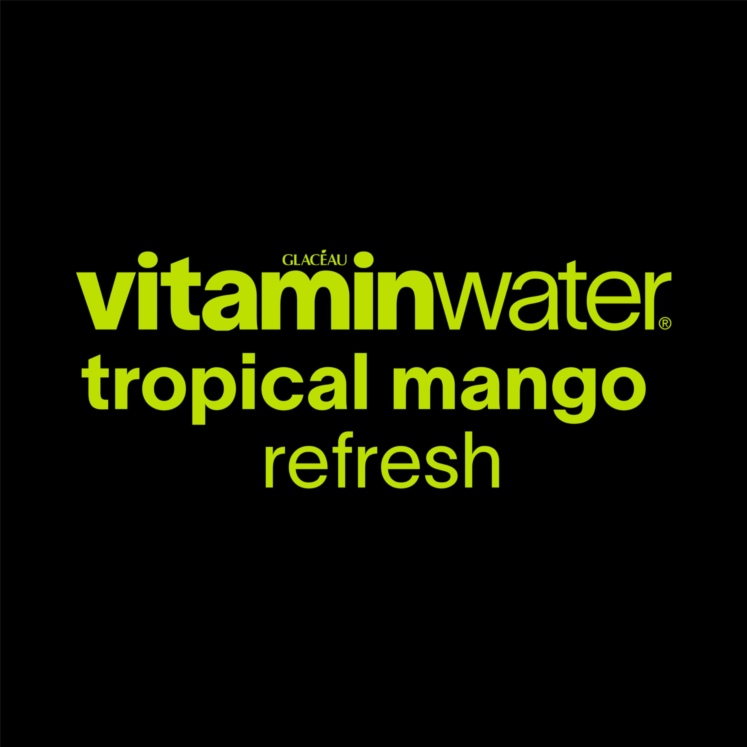 vitaminwater Refresh Tropical Mango glass with straw ready for a refreshing sip.