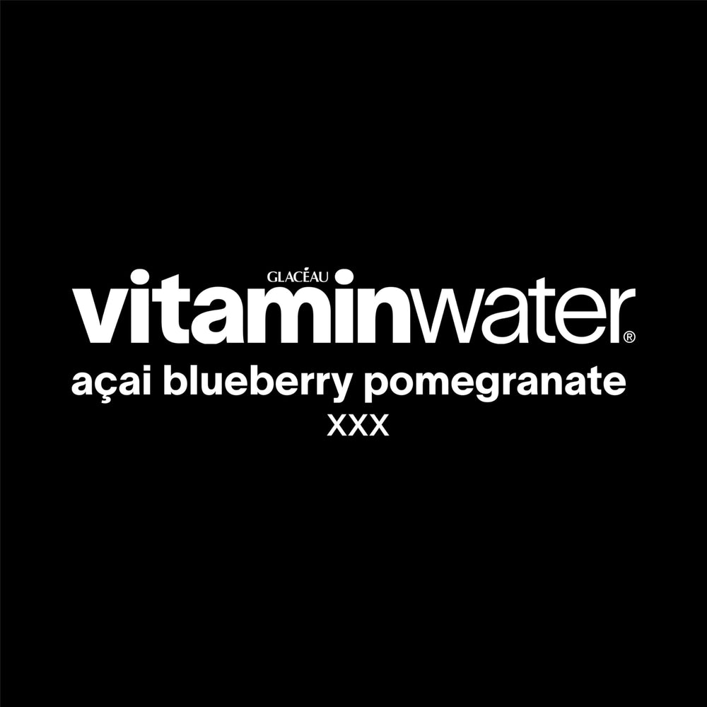 Chilled Vitaminwater XXX Açai Blueberry Pomegranate glass ready to sip.