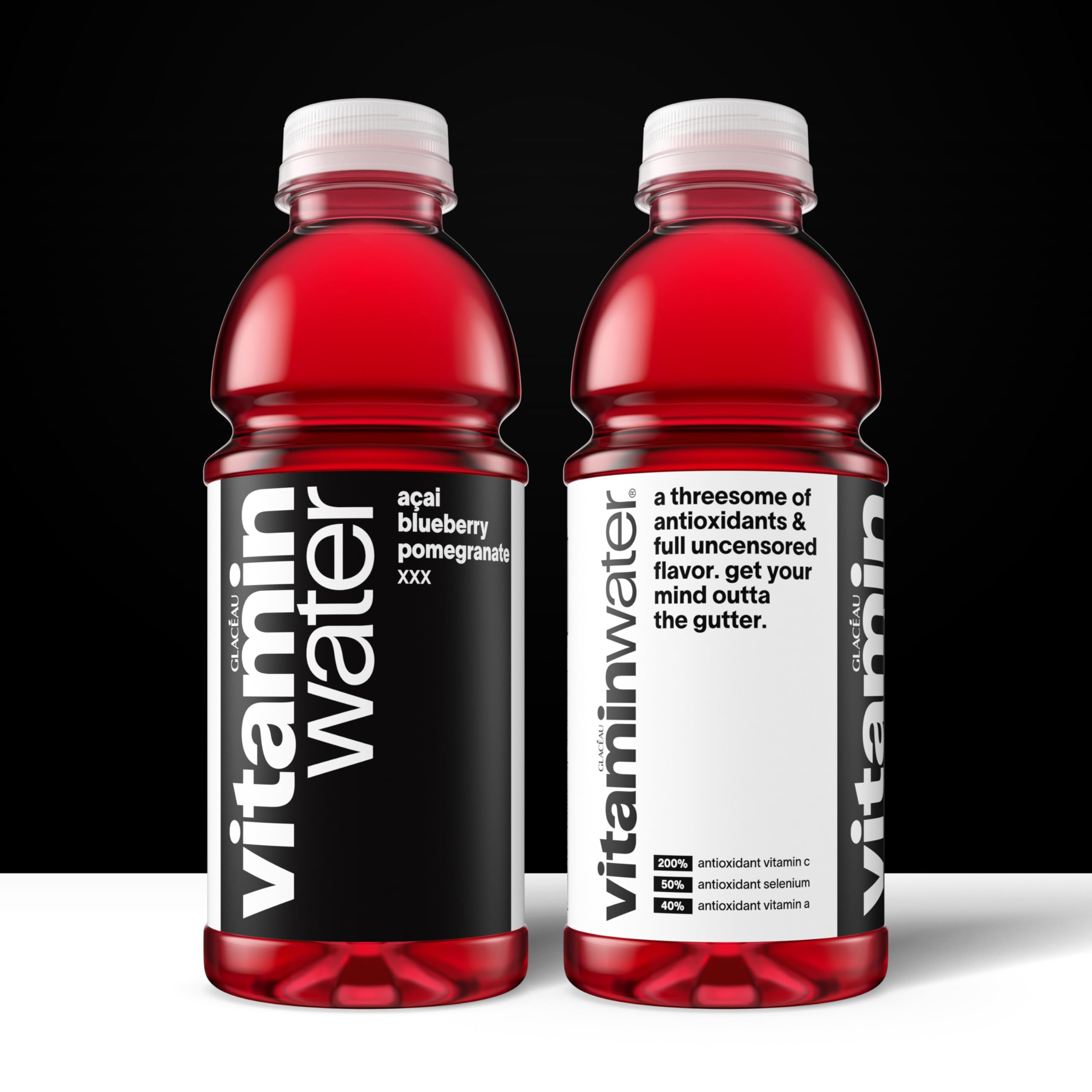 Pouring Vitaminwater XXX Açai Blueberry Pomegranate into a glass for hydration.