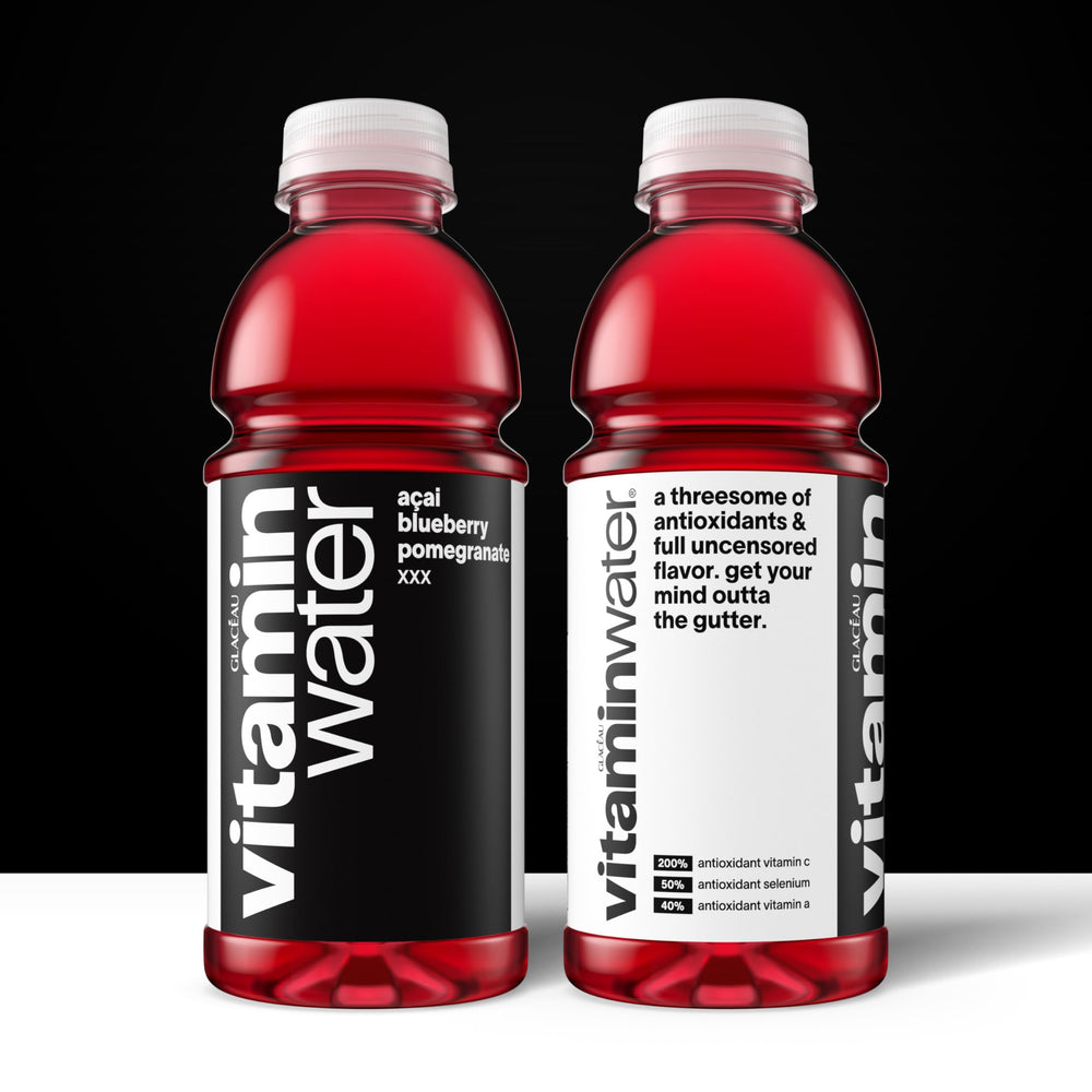 Pouring Vitaminwater XXX Açai Blueberry Pomegranate into a glass for hydration.