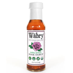 Wäbry Organic Rose Syrup bottle highlighting natural color and rose flavor for beverages.