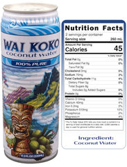 Wai Koko pours coconut water into a glass for refreshment