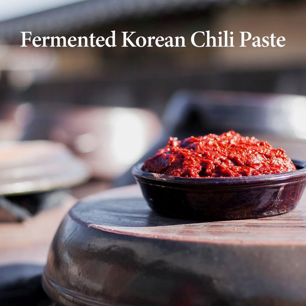 Wang Gochujang jar close-up emphasizes deep fermentation and rich color.