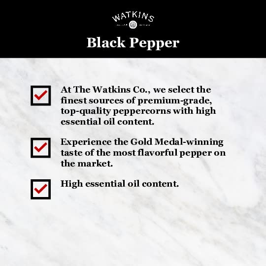 Close-up of pepper grains in the Watkins tin for vibrant, consistent seasoning.