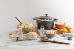 Watkins Ranch popcorn seasoning bottle enhances creamy tang on popcorn.