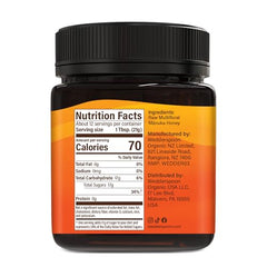 Close-up of Wedderspoon Manuka honey with creamy texture for spreading.