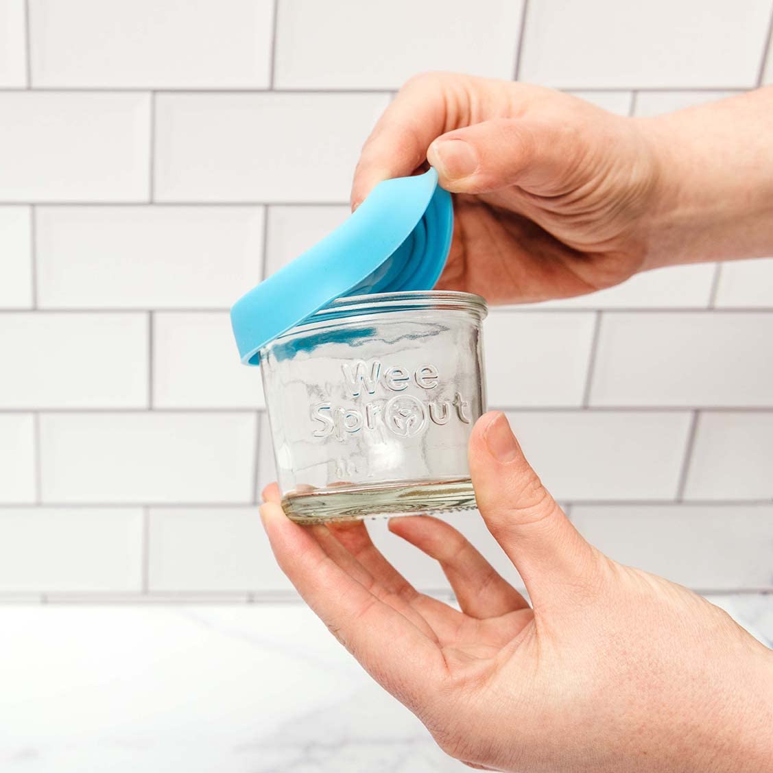 WeeSprout 4oz jars feature embossed measurement markers for precise portions.