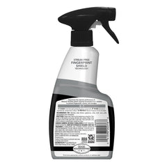 Weiman stainless steel cleaner being sprayed on a fridge door