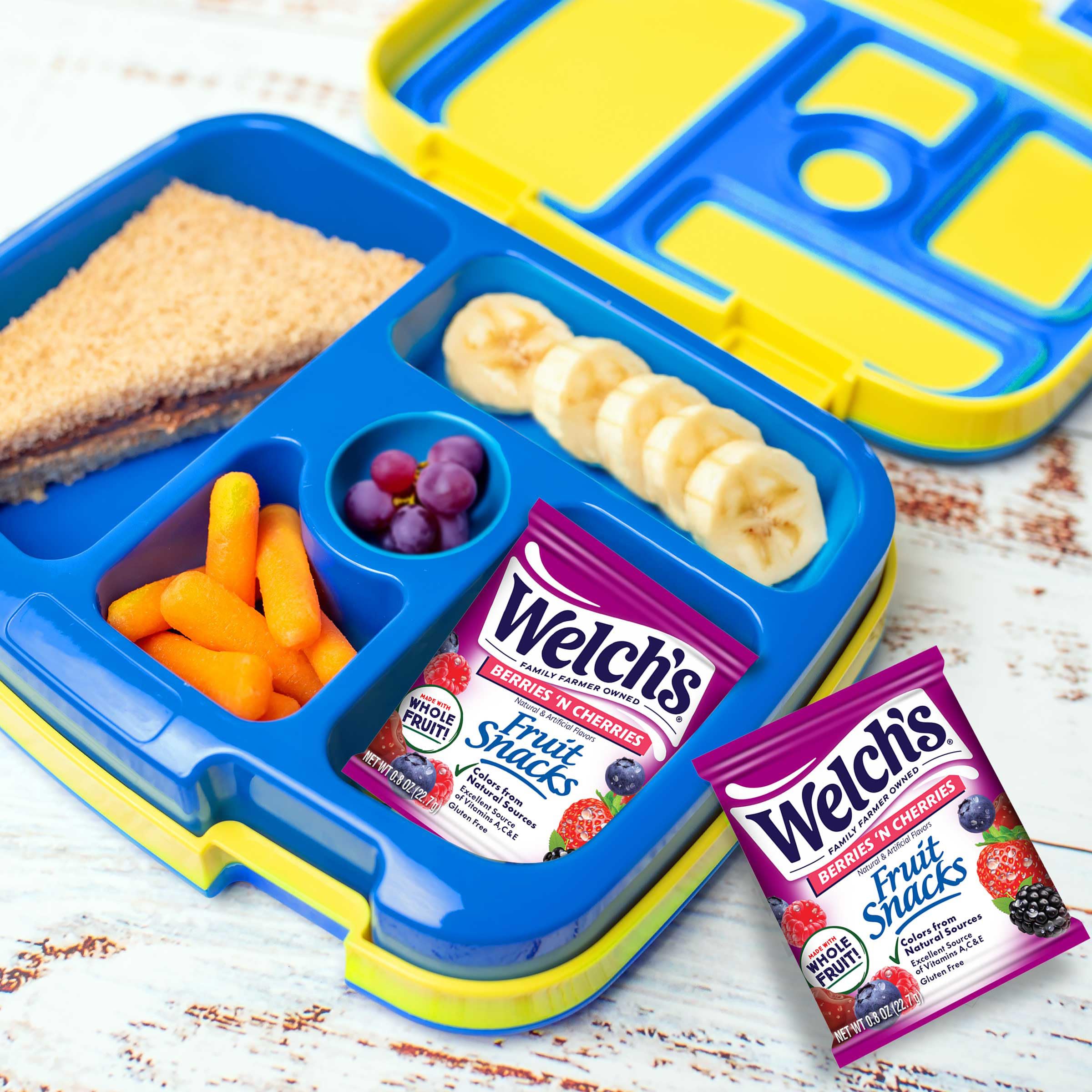 Kids enjoying Welch's Berries 'N Cherries during school lunch.