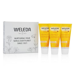 Weleda diaper cream being applied to the diaper area for soothing care.