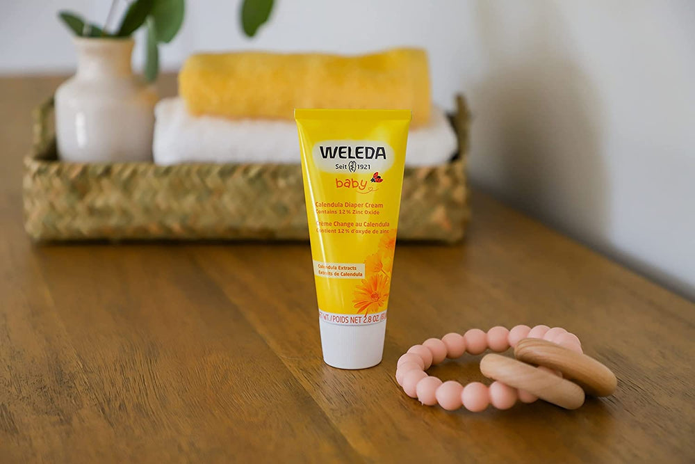 Pack of three Weleda Baby Calendula Diaper Cream tubes for family use.