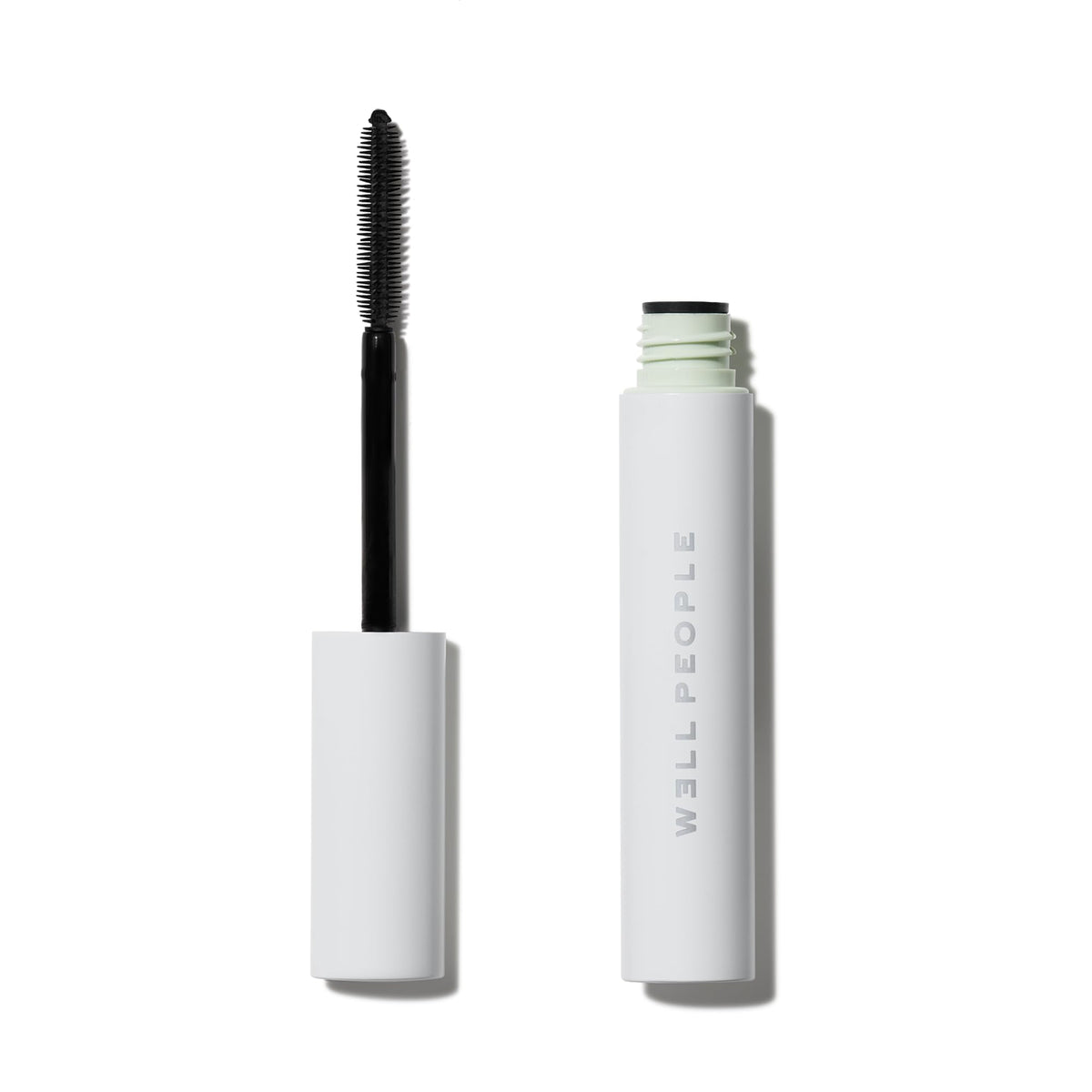 Well People Expressionist Mascara brush close-up showing precise lengthening and even coverage.