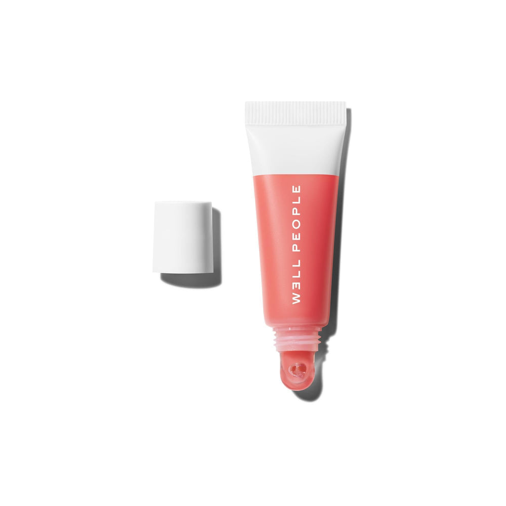 Well People Poutlove peptide lip balm application shows silky hydration and a subtle plump look