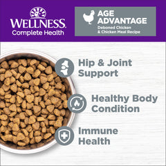 Close-up of Wellness senior chicken kibble highlighting real deboned chicken.