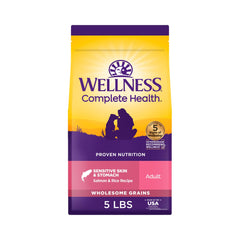 Wellness Complete Health dog food front bag shows salmon and rice for sensitive stomach