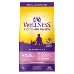 Wellness kitten dry food kibble closeup shows high-quality protein for growing kittens.