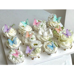 Weraru edible wafer butterfly cupcake topper in mixed colors for festive decorations.