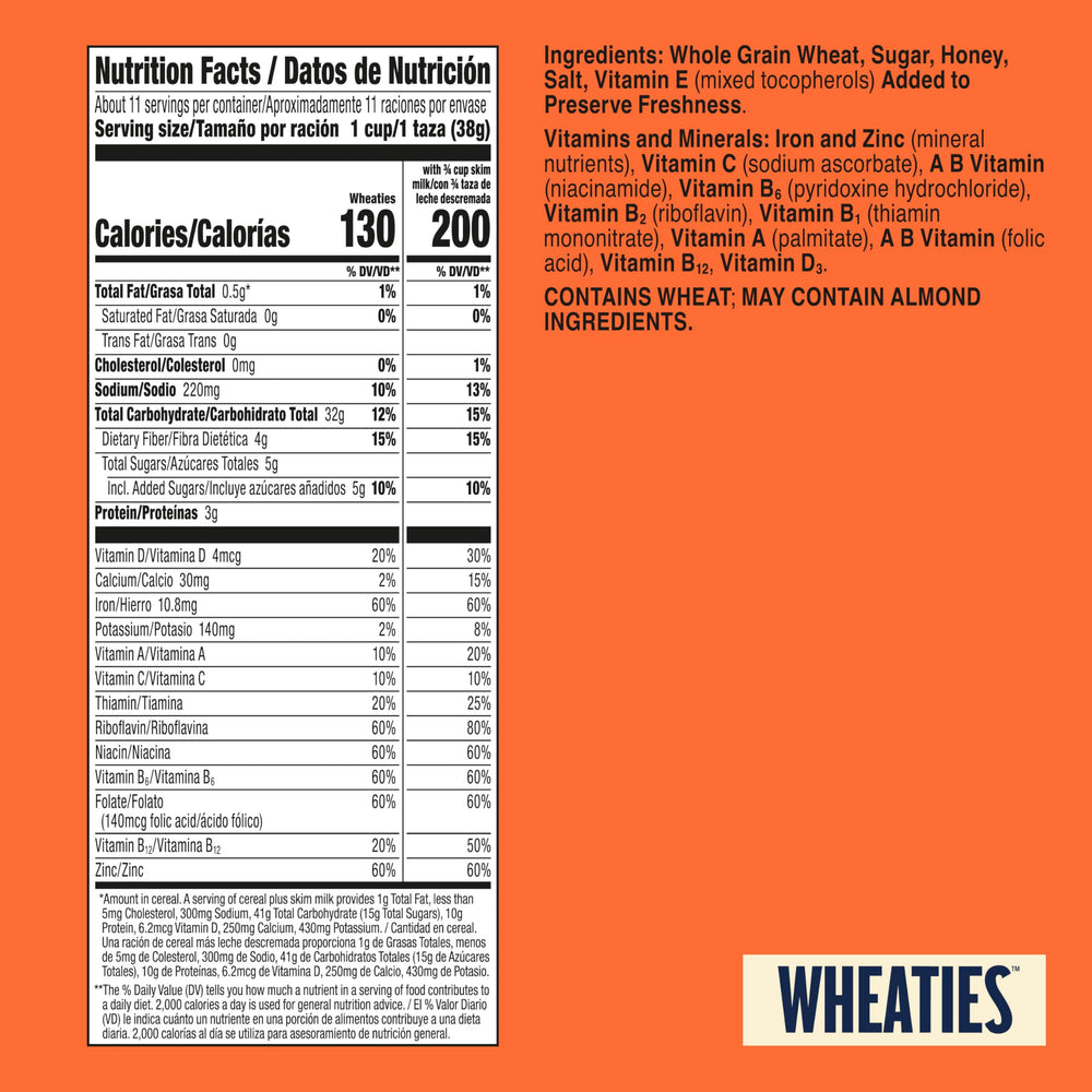 Pouring Wheaties into a bowl with milk for a quick breakfast.