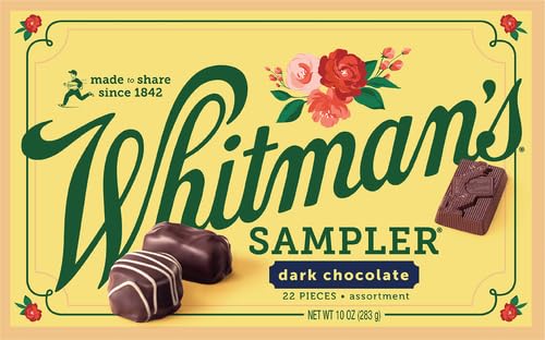 Whitman's Sampler cashew clusters beside glossy dark chocolate for a crunchy bite.