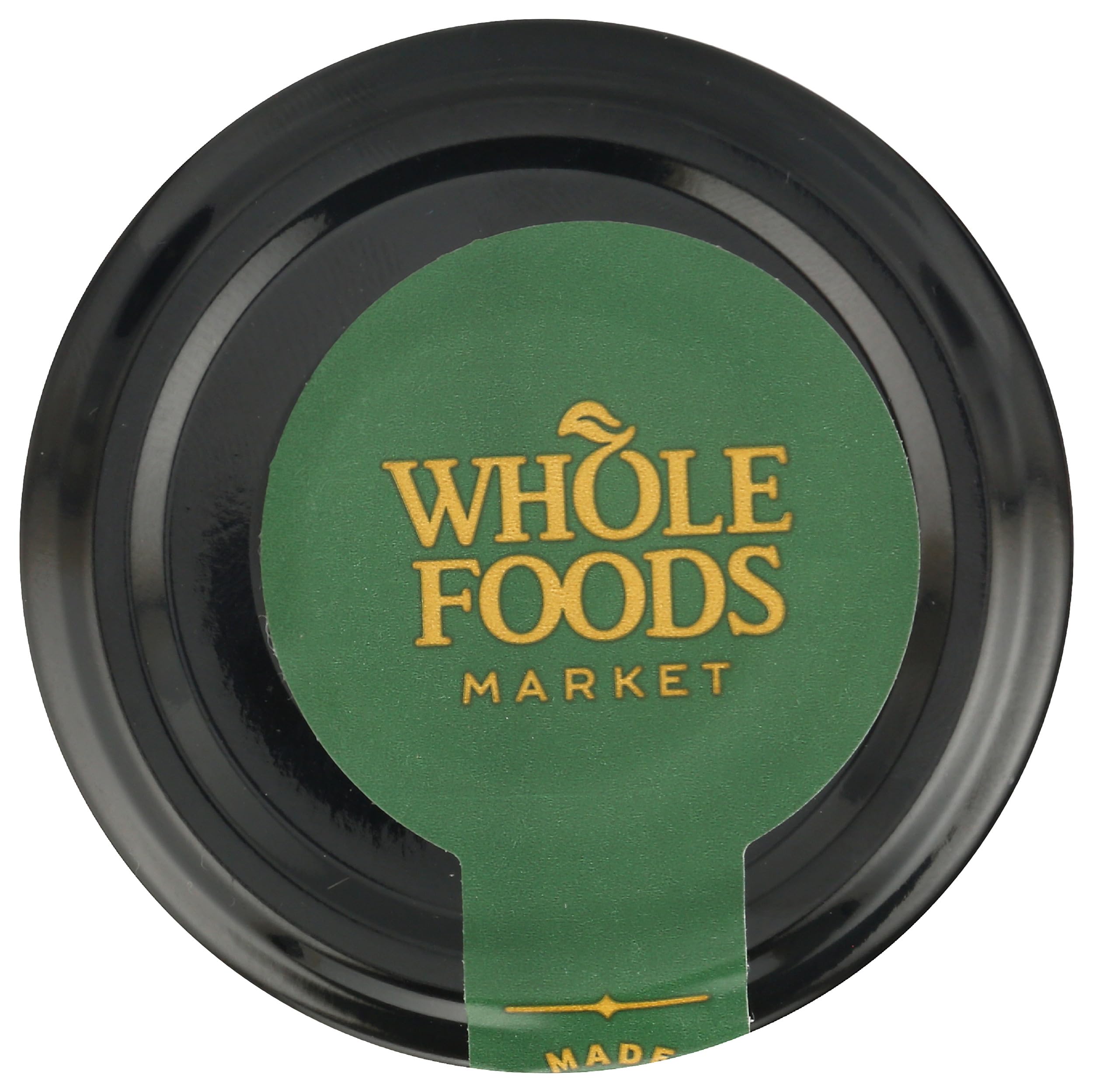 Jar of Whole Foods Market Basil Pesto on kitchen counter.