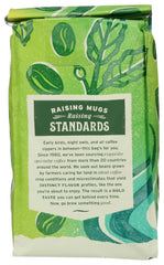 Whole Foods Market dark Italian roast beans close-up, highlighting full-bodied flavor potential.