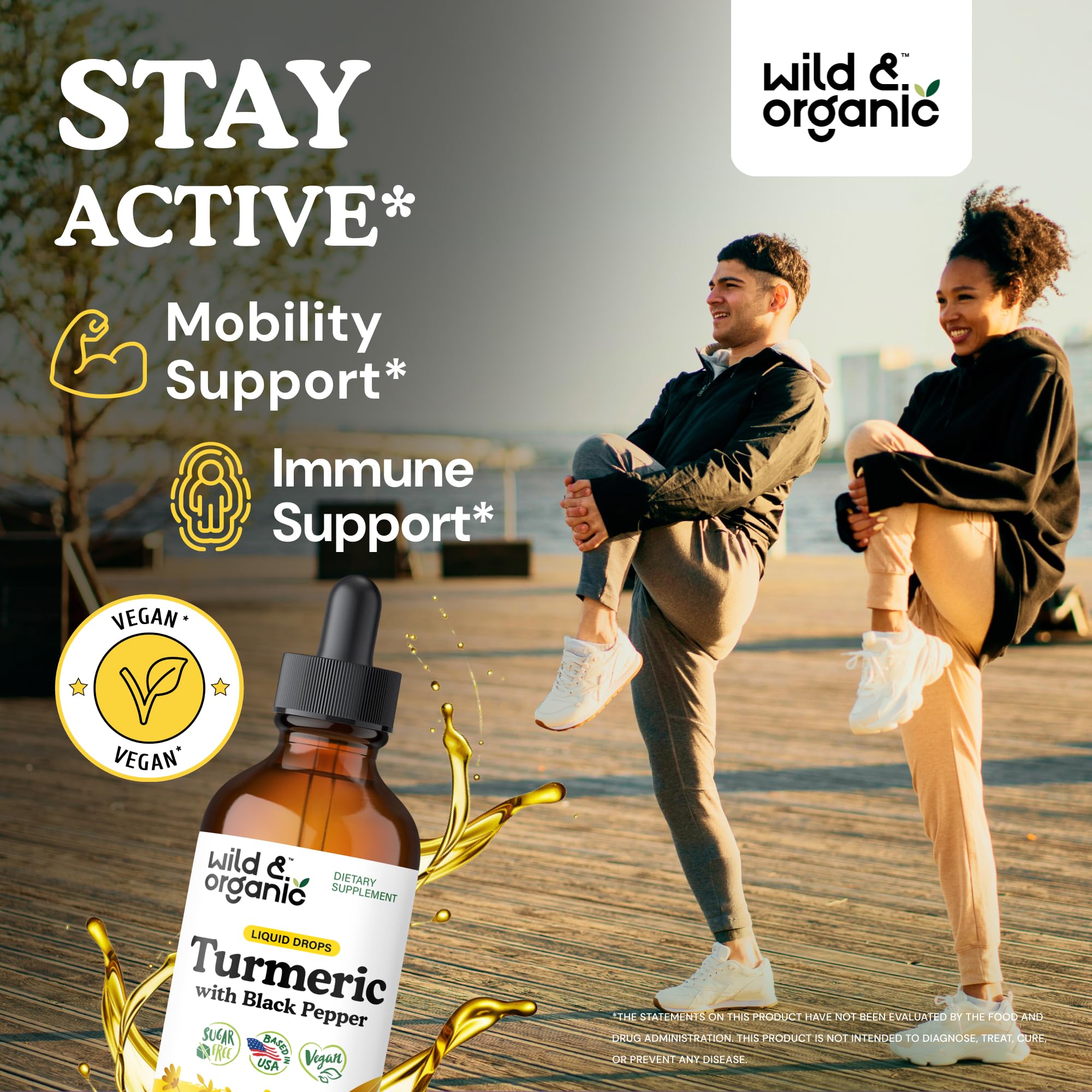 Pouring Wild & Organic Turmeric Drops into tea for a warm, earthy sip.