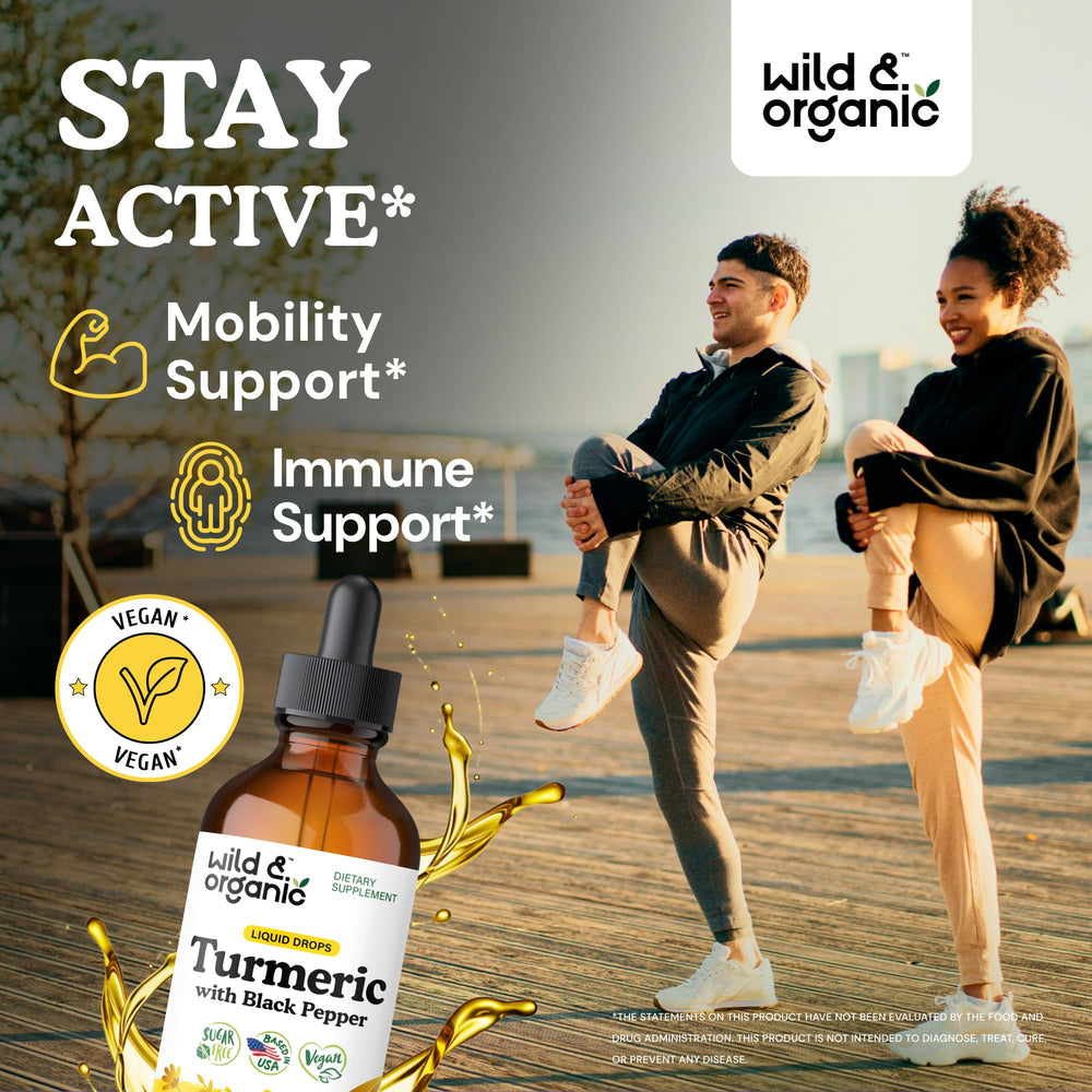 Pouring Wild & Organic Turmeric Drops into tea for a warm, earthy sip.