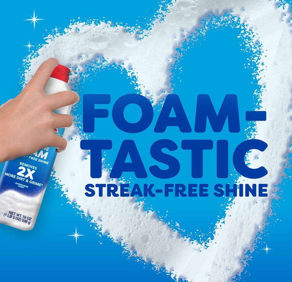 Windex Fast Shine Foam spray nozzle positioned for targeted cleaning on glass.