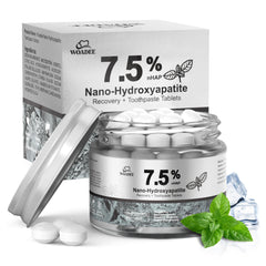Woadee toothpaste tablets in a glass jar for eco-friendly travel care.