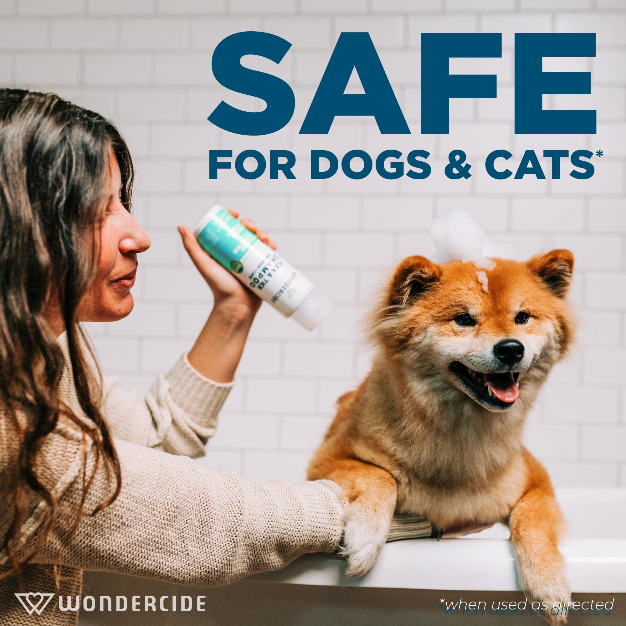 Wondercide cedarwood shampoo being applied during a pet bath
