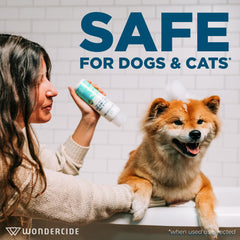 Wondercide cedarwood shampoo being applied during a pet bath